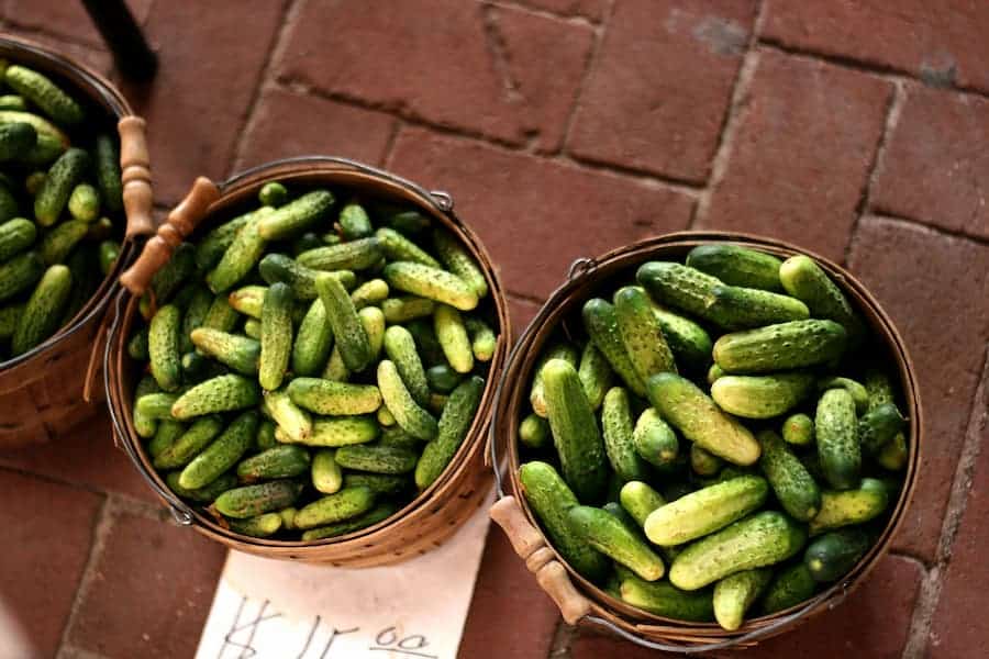 Basket of pickles on the brick floor